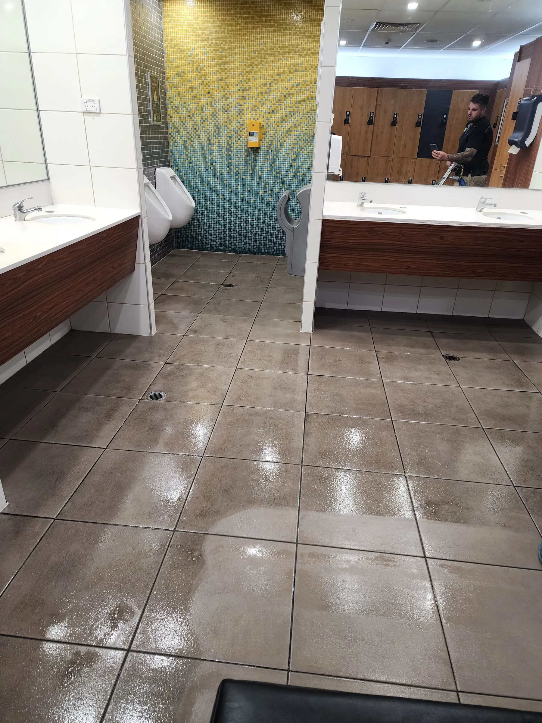 Washroom after the visit: tile floor and vanity clean and shining